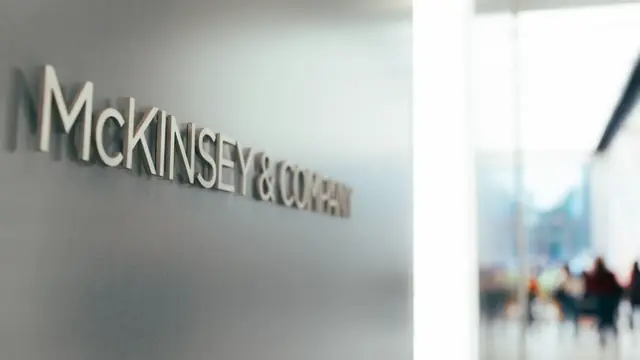 McKinsey & Company sign on a frosted glass office wall (lead image from the WSJ story)