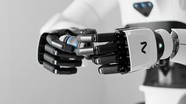 Close-up of a white and black humanoid robot hand with articulated fingers