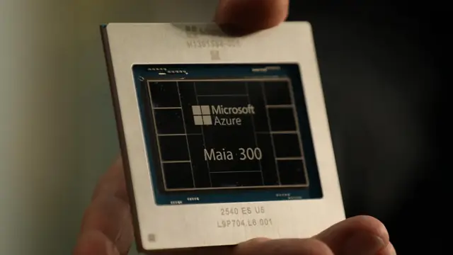 A hand holding a Microsoft Azure Maia 300 AI chip
