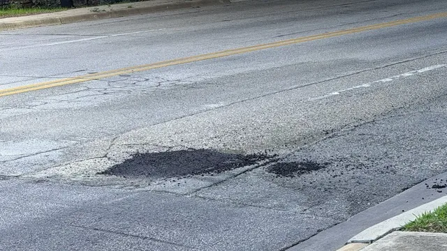 Freshly patched pothole on an Austin street, from the author's photo